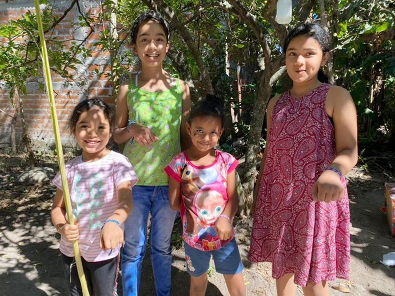 El Salvadorian children with bracelets made by OPhiA
